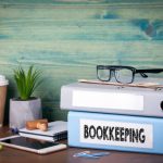 mage of books for a bookkeeper on a desk.