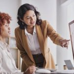 Image of two women at a computer.