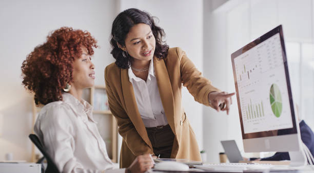 Image of two women at a computer.